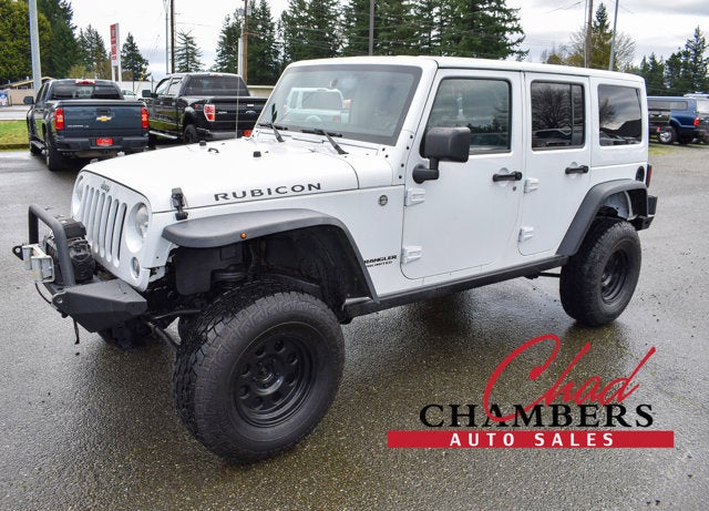 2014 Jeep Wrangler Unlimited Rubicon in Bright White Clearcoat — front three-quarter view