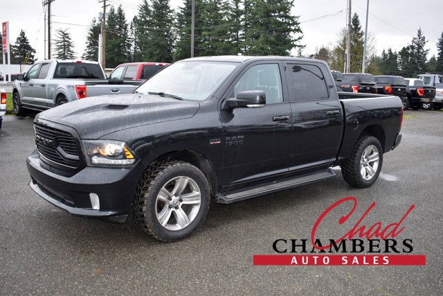 2018 RAM 1500 Sport in Brilliant Black Crystal Pearlcoat — front three-quarter view