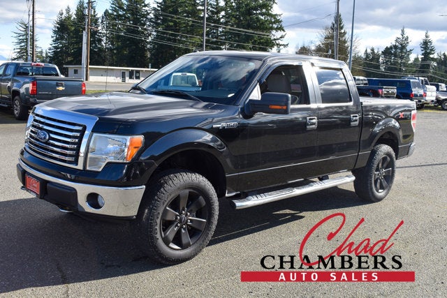 2010 Ford F-150 XLT PICKUP 4D 5 1/2 FT in Black — front three-quarter view