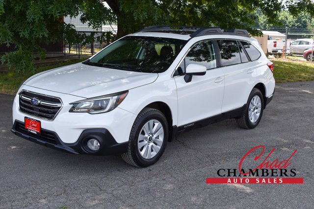2018 Subaru Outback Premium in Crystal White Pearl — front three-quarter view