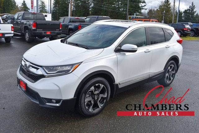 2019 Honda CR-V Touring in White — front three-quarter view